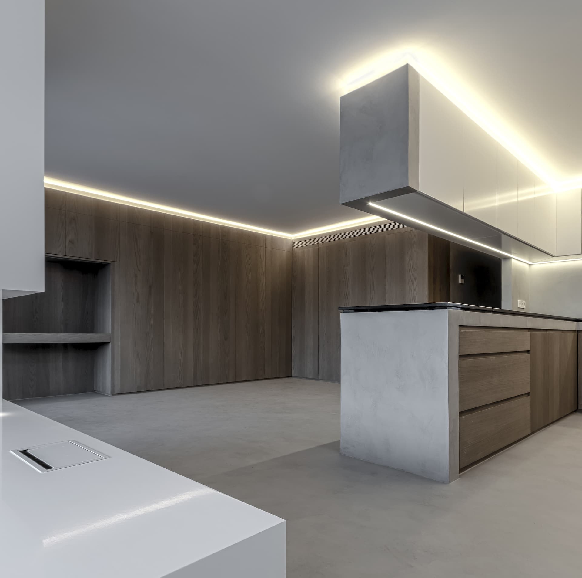 Cocina minimalista con tecnocemento y madera en vivienda Julia — estudio de arquitectura Alicante tamatestudio